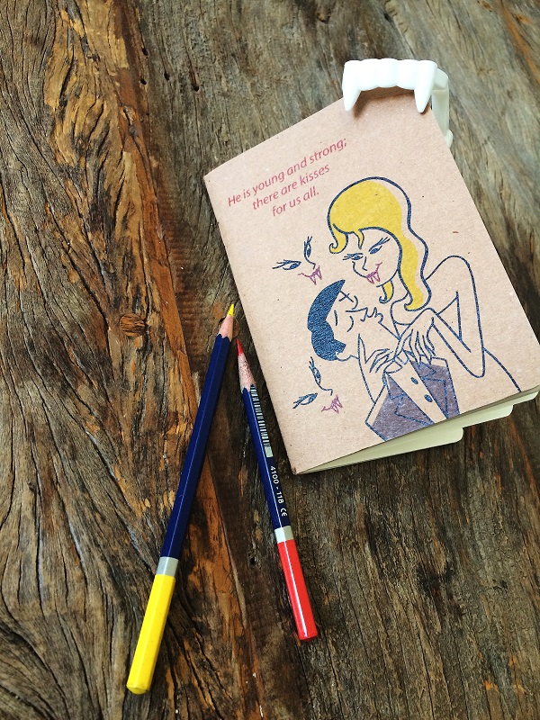 AtitAgain! BooksUpstairs Romping through Dracula notebook with colour pencils on wooden table